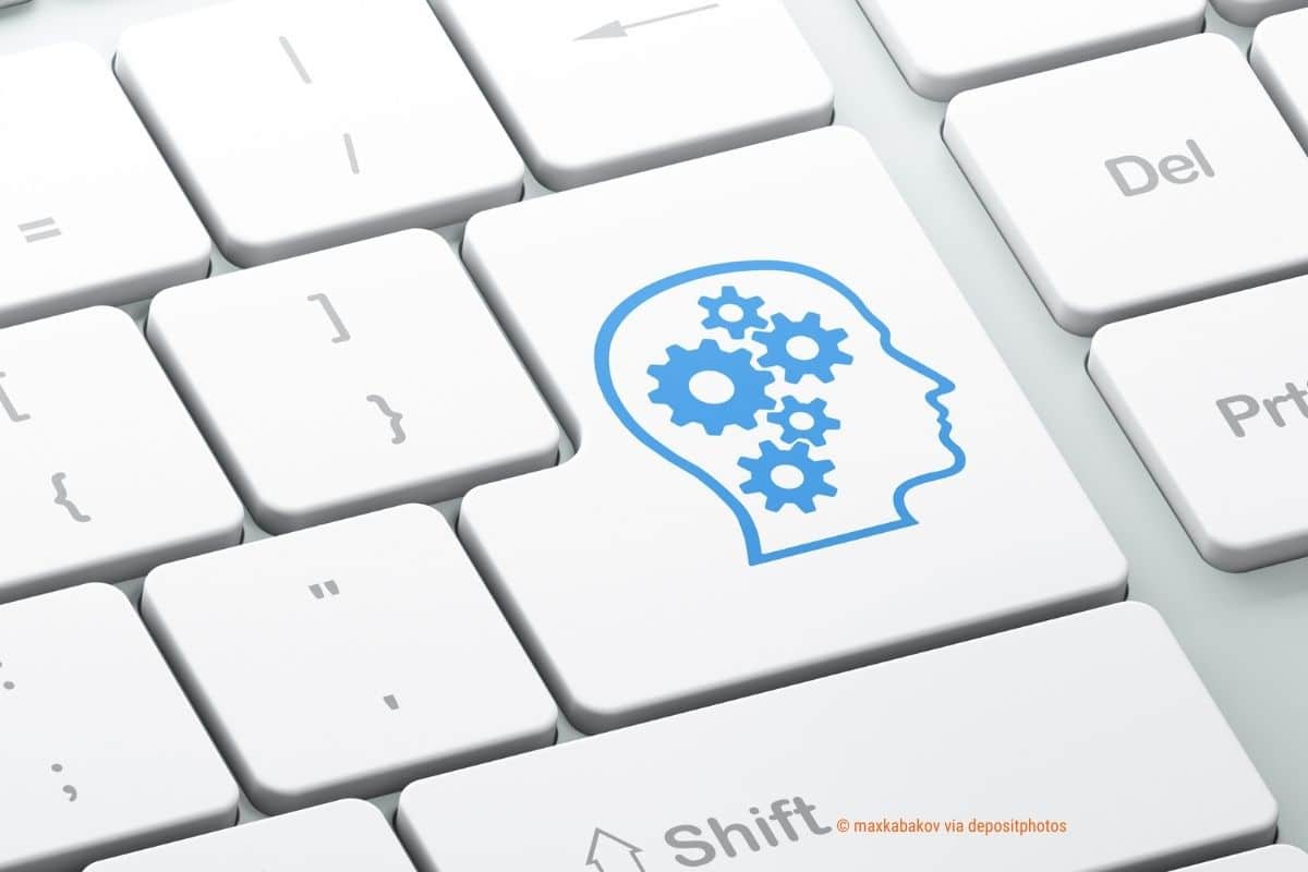 Das Bild zeigt eine Tastatur mit einem Kopf und Zahnrädern auf der Enter-Taste – Perfektionismus in Social Media adé (Photocredit: maxkabakov via depositphotos)